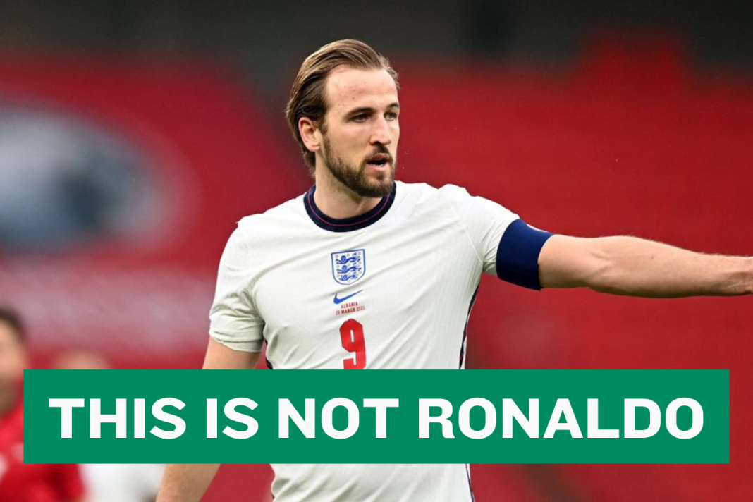 Harry Kane with a banner reading 